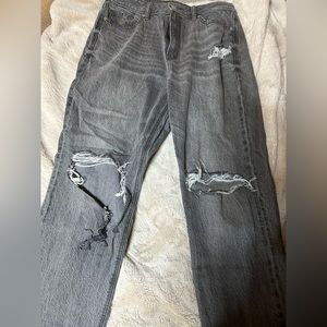Black American Eagle mom jeans with rips.
